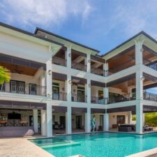 3 story residential backyard with a pool