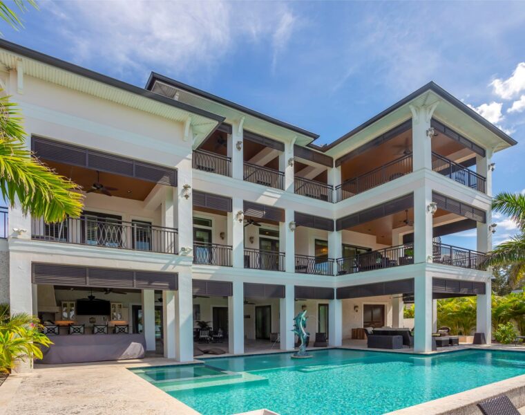 3 story residential backyard with a pool