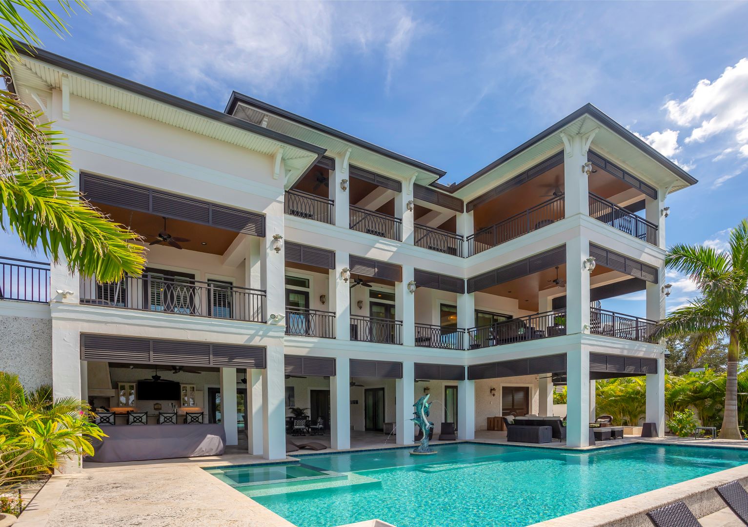 3 story residential backyard with a pool