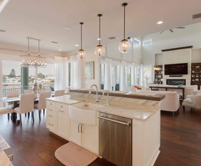 white marble kitchen overlooking living room