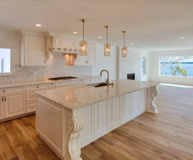 white kitchen with a bayside view